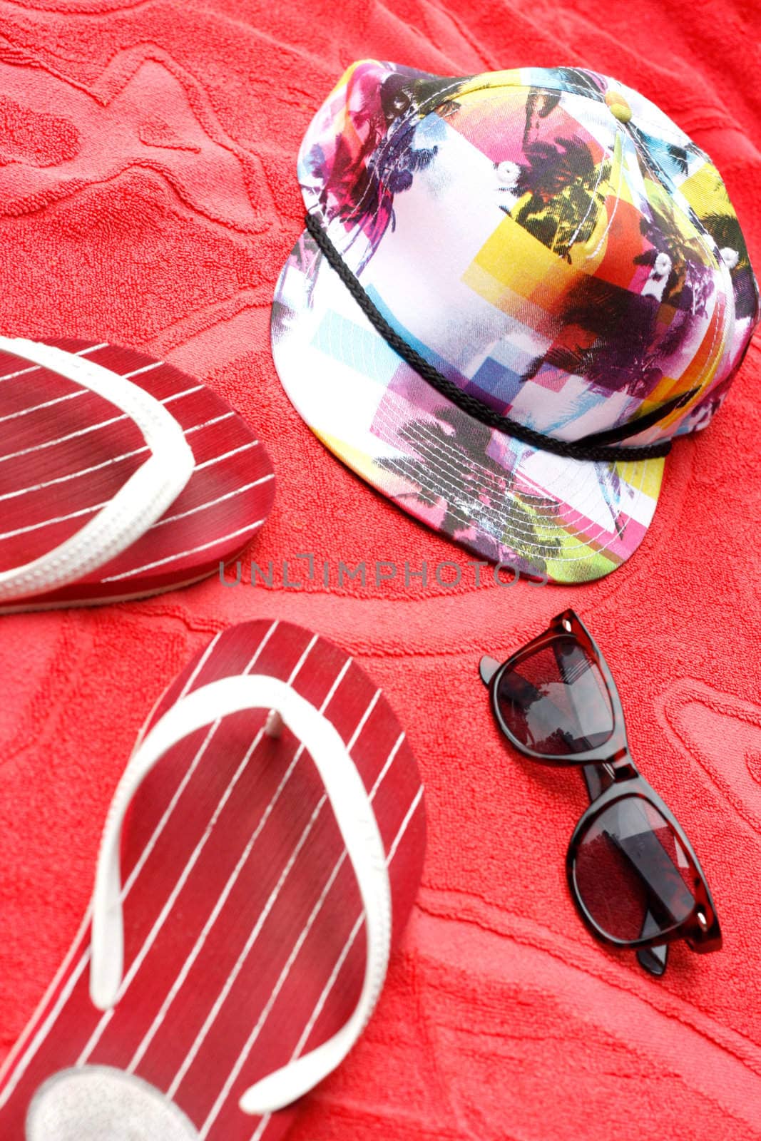 Flip flops, sunglasses and a cap by leeser