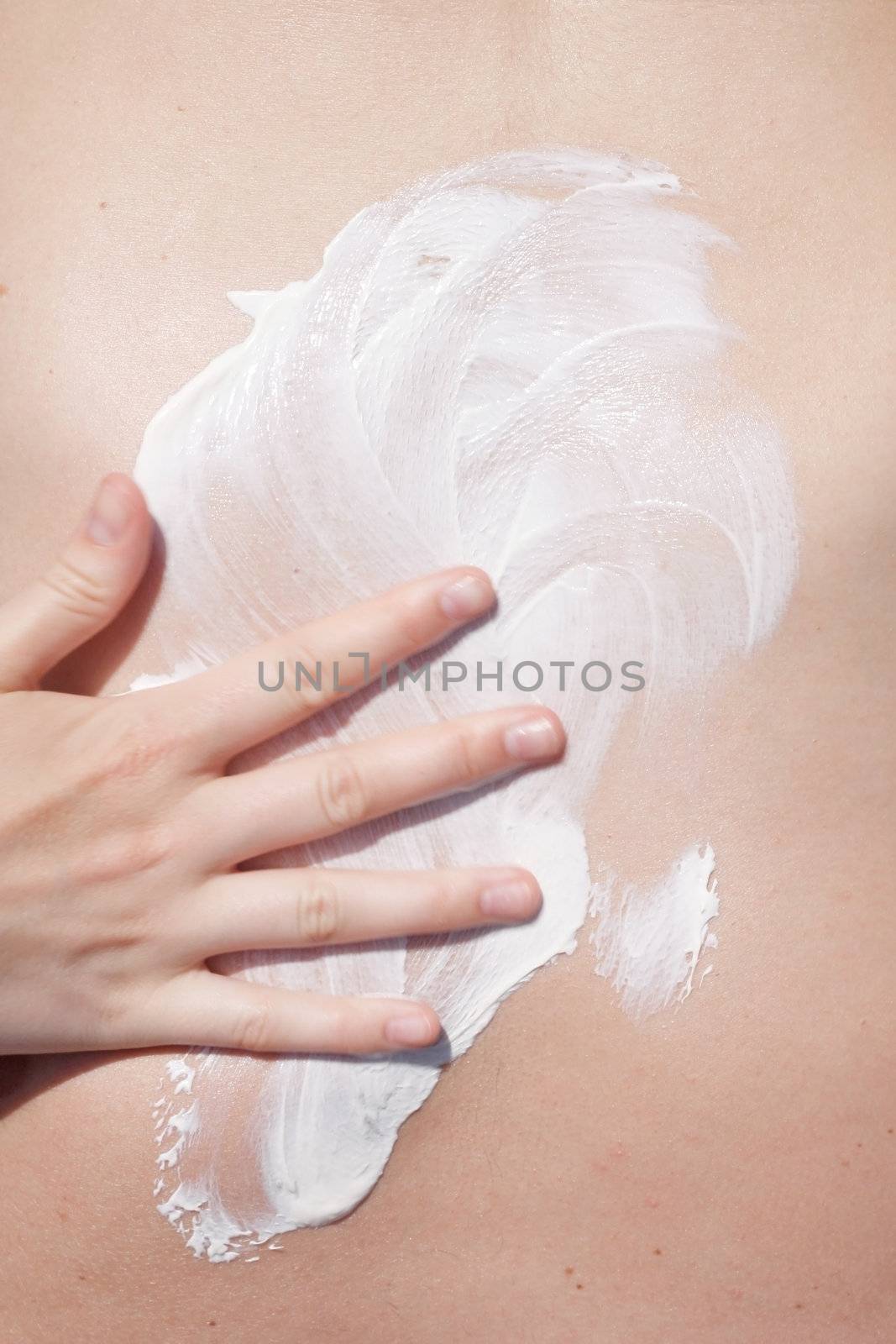 A man applying sunscreen