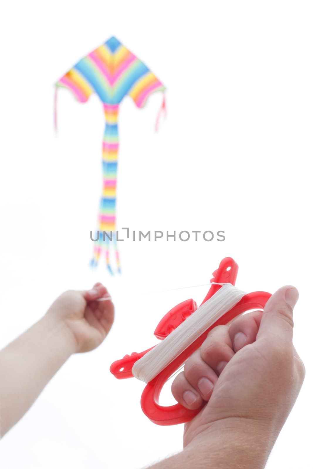 A boy playing with a kite