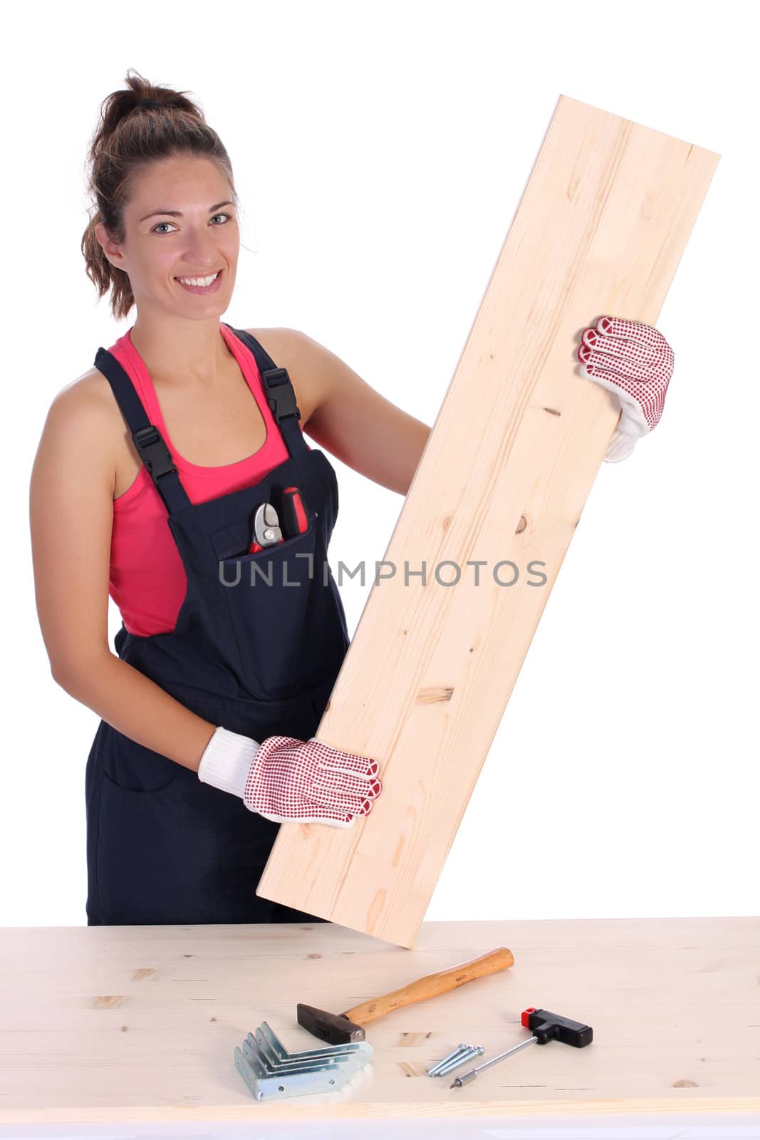 woman carpenter holding wooden plank  by vladacanon