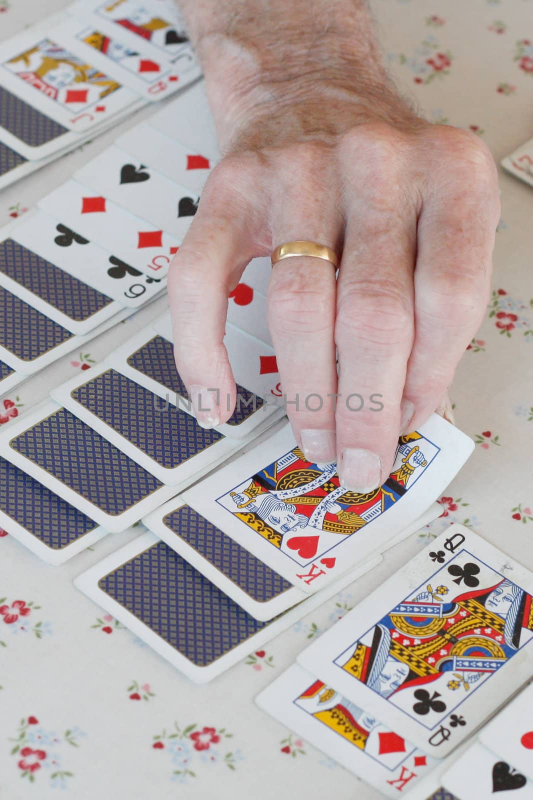 Senior playing solitaire