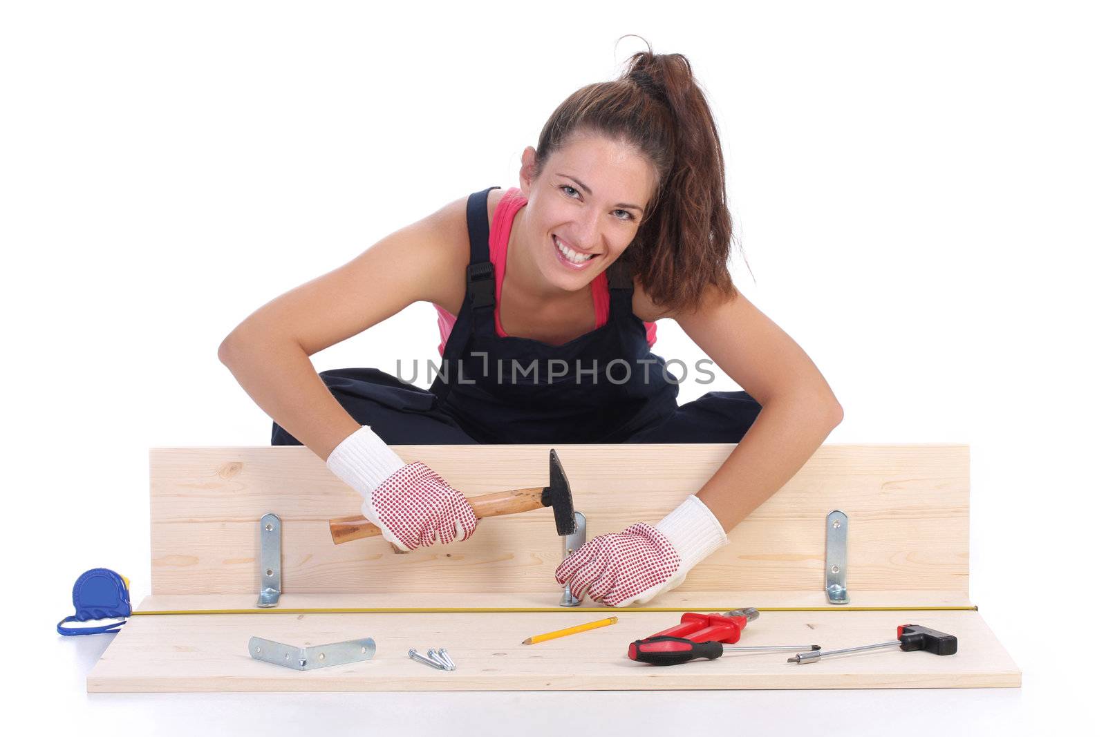 woman carpenter at work on white background 