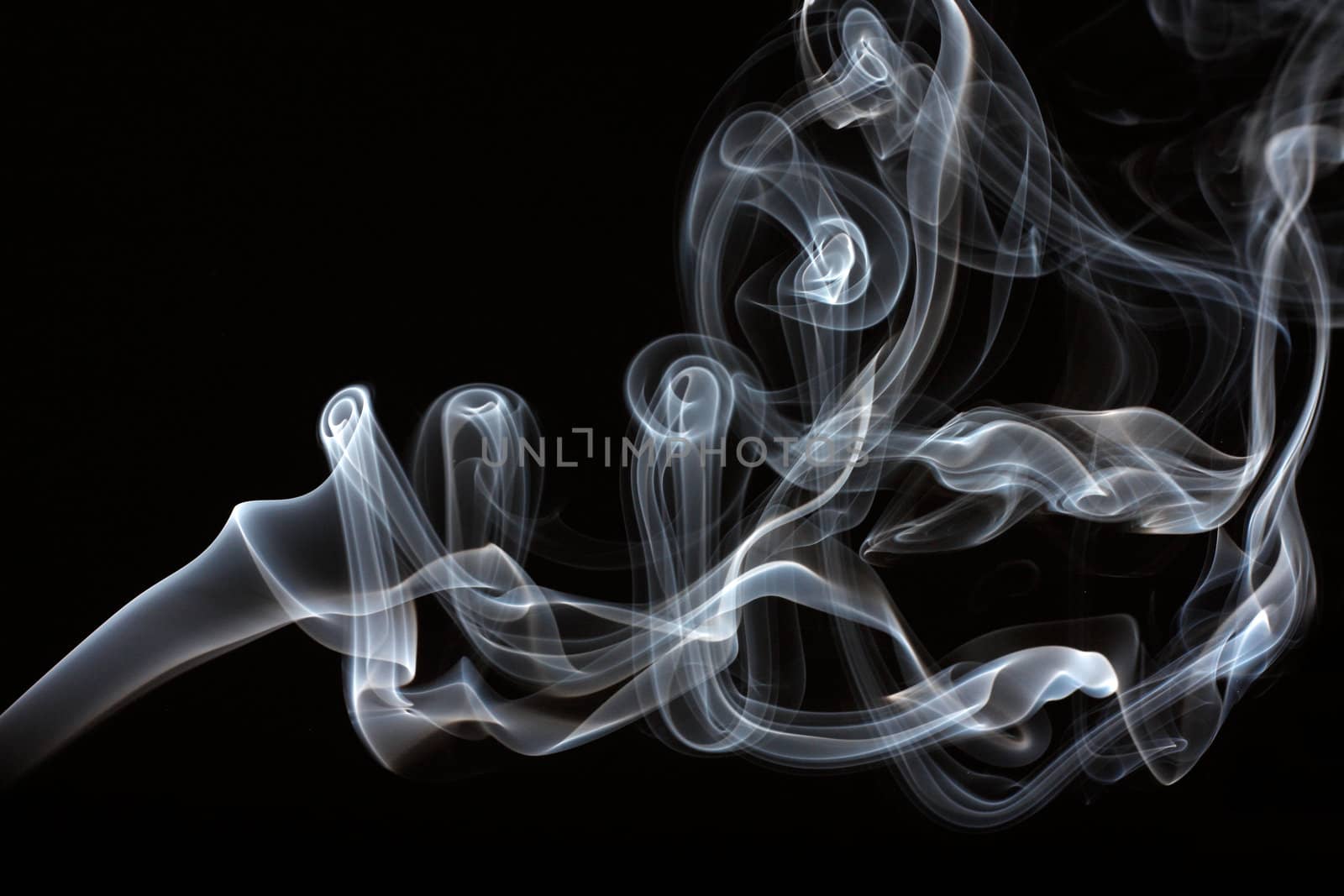 Abstract smoke curling and creating beautiful shapes