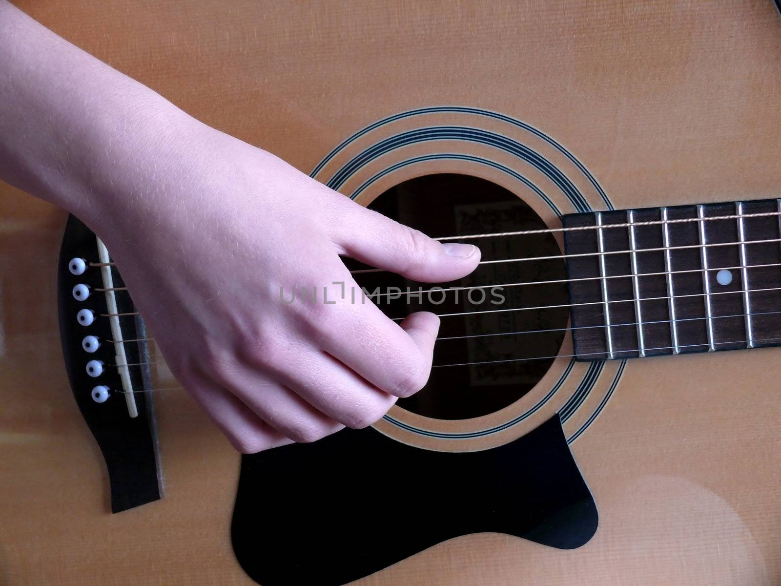 portrait of woman training on guitar playing