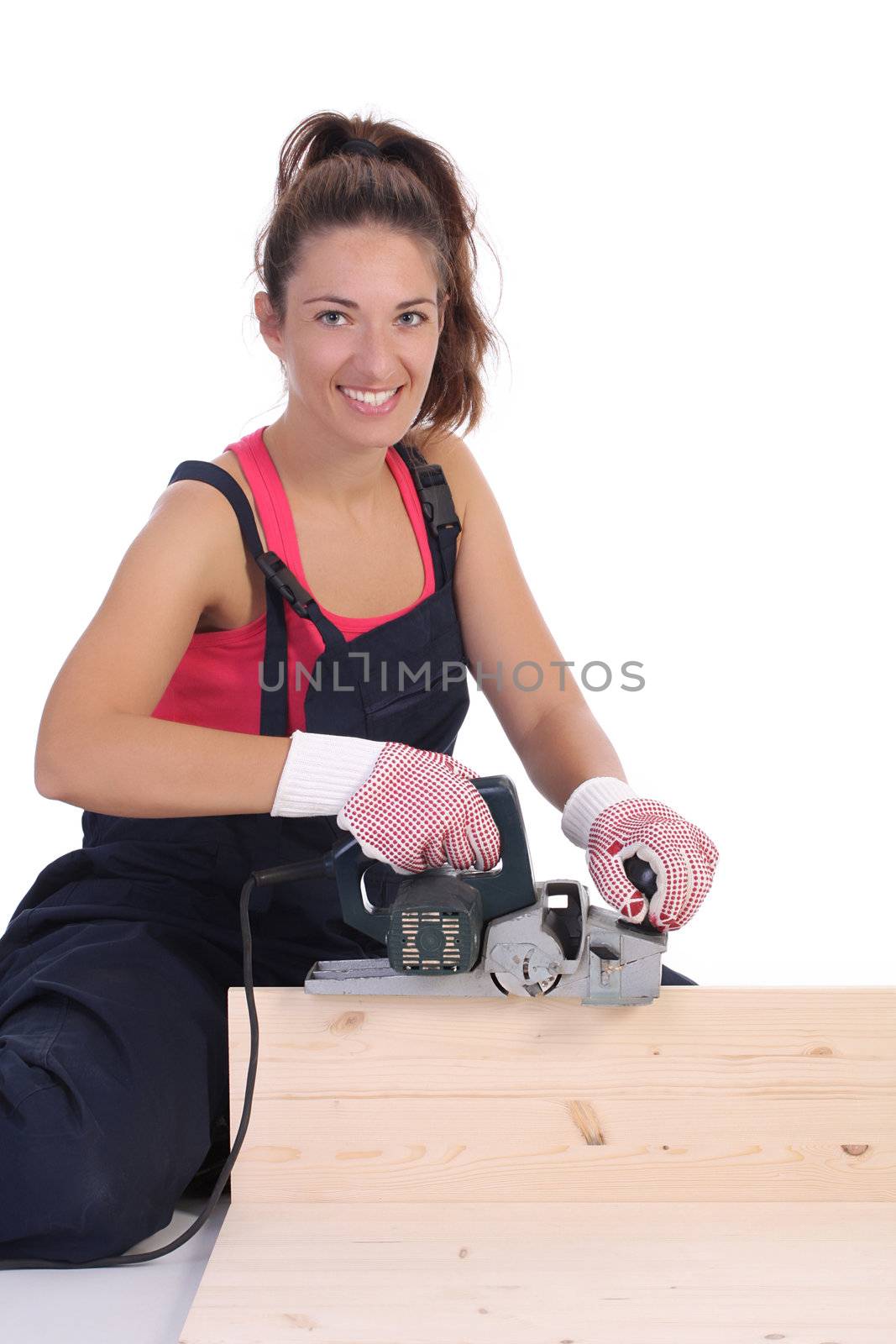 woman carpenter at work on white background 