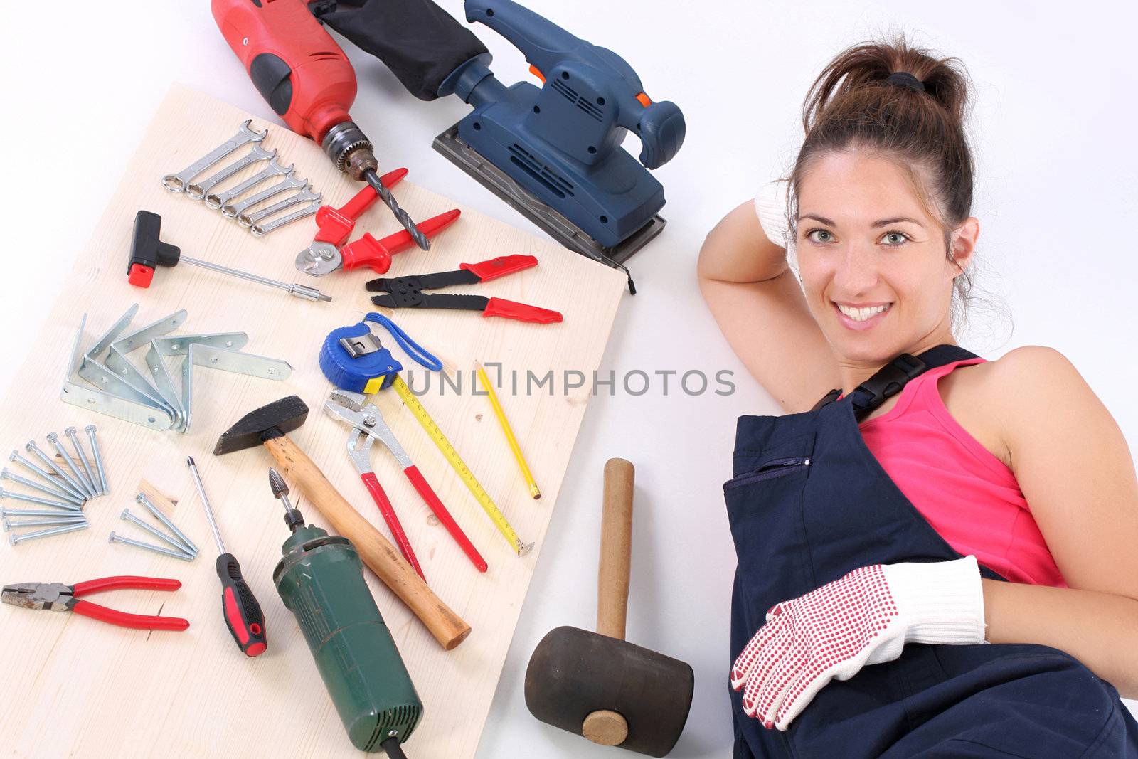 woman carpenter with work tools  by vladacanon
