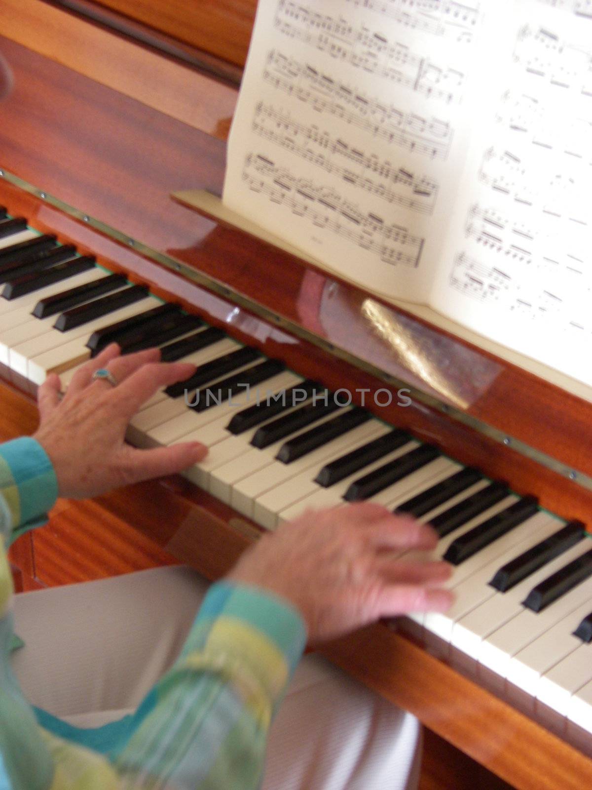 Senior woman playing piano