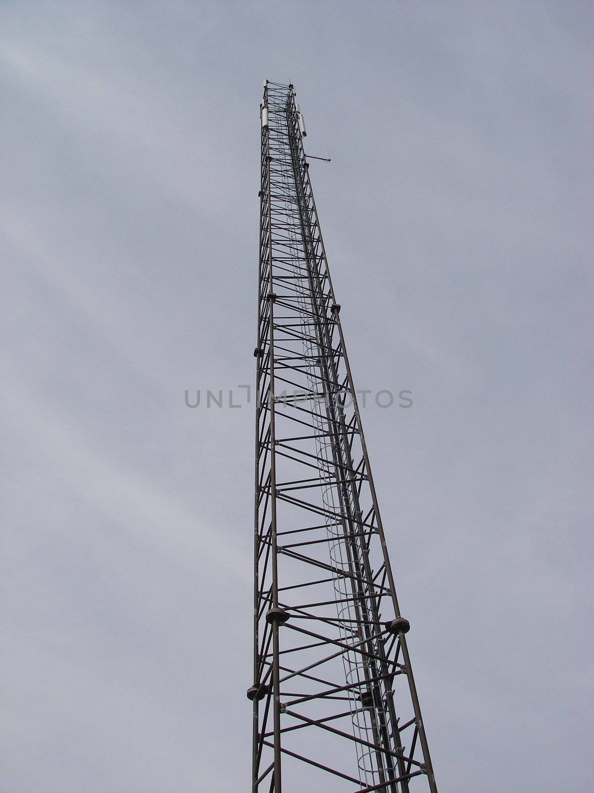 portrait of endless communication-tower reach for sky on smooth background