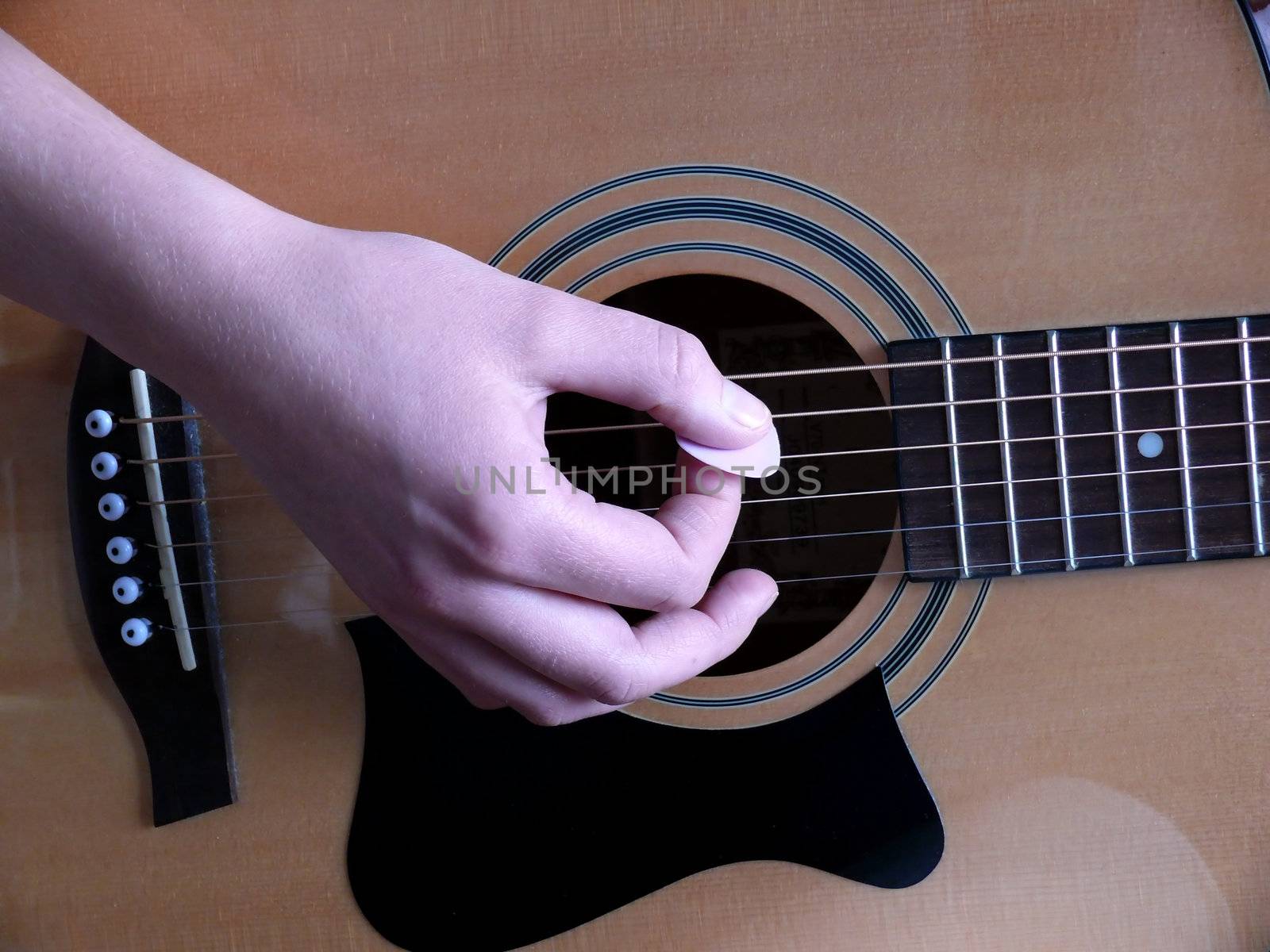 portrait of woman training on guitar playing