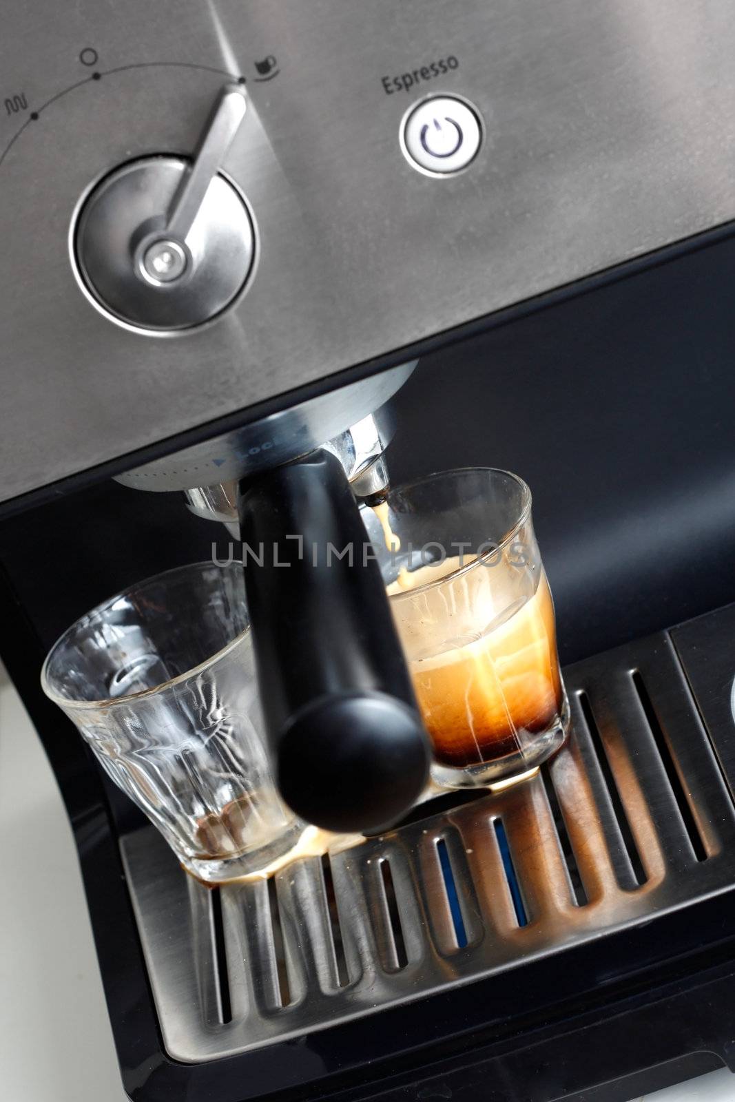 Espresso machine brewing a coffee espresso