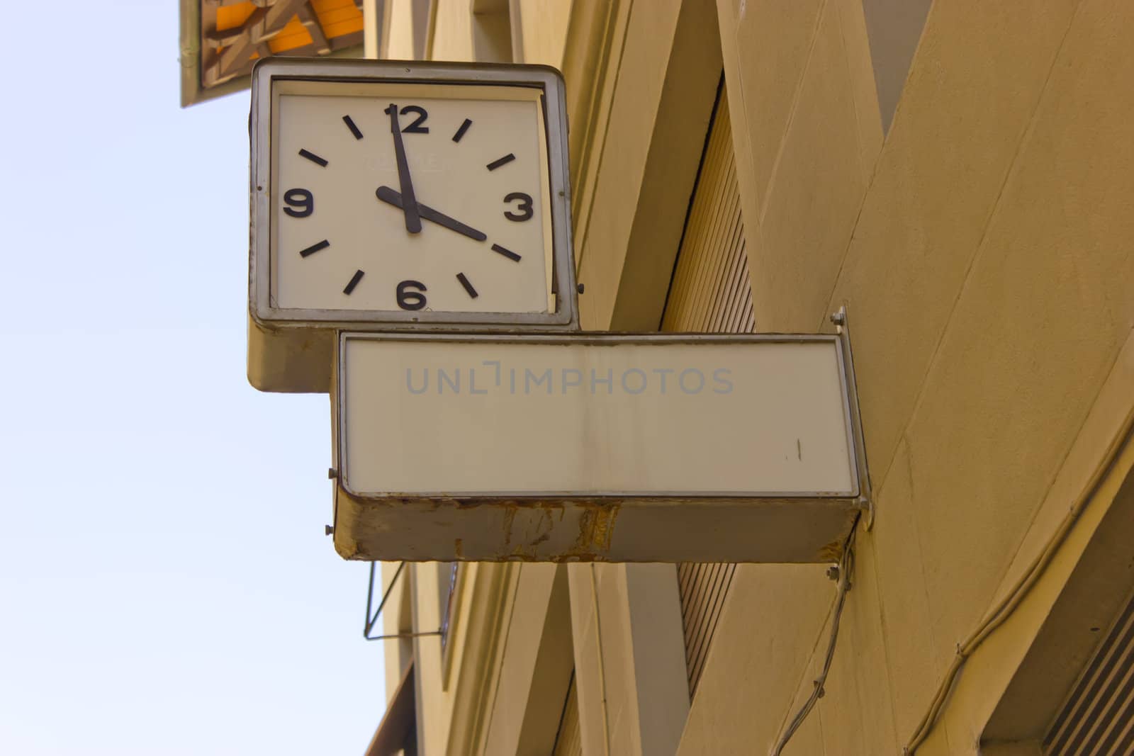 Street clock with blank notice.
