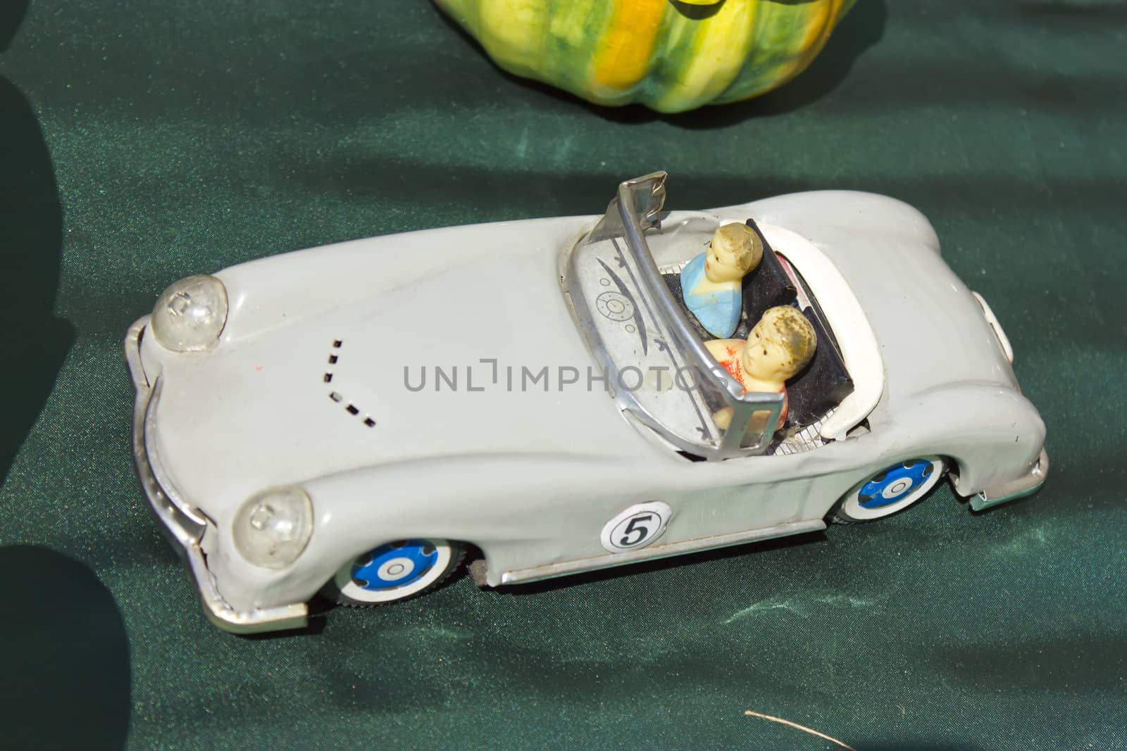Image of a vintage toy car at flea market.