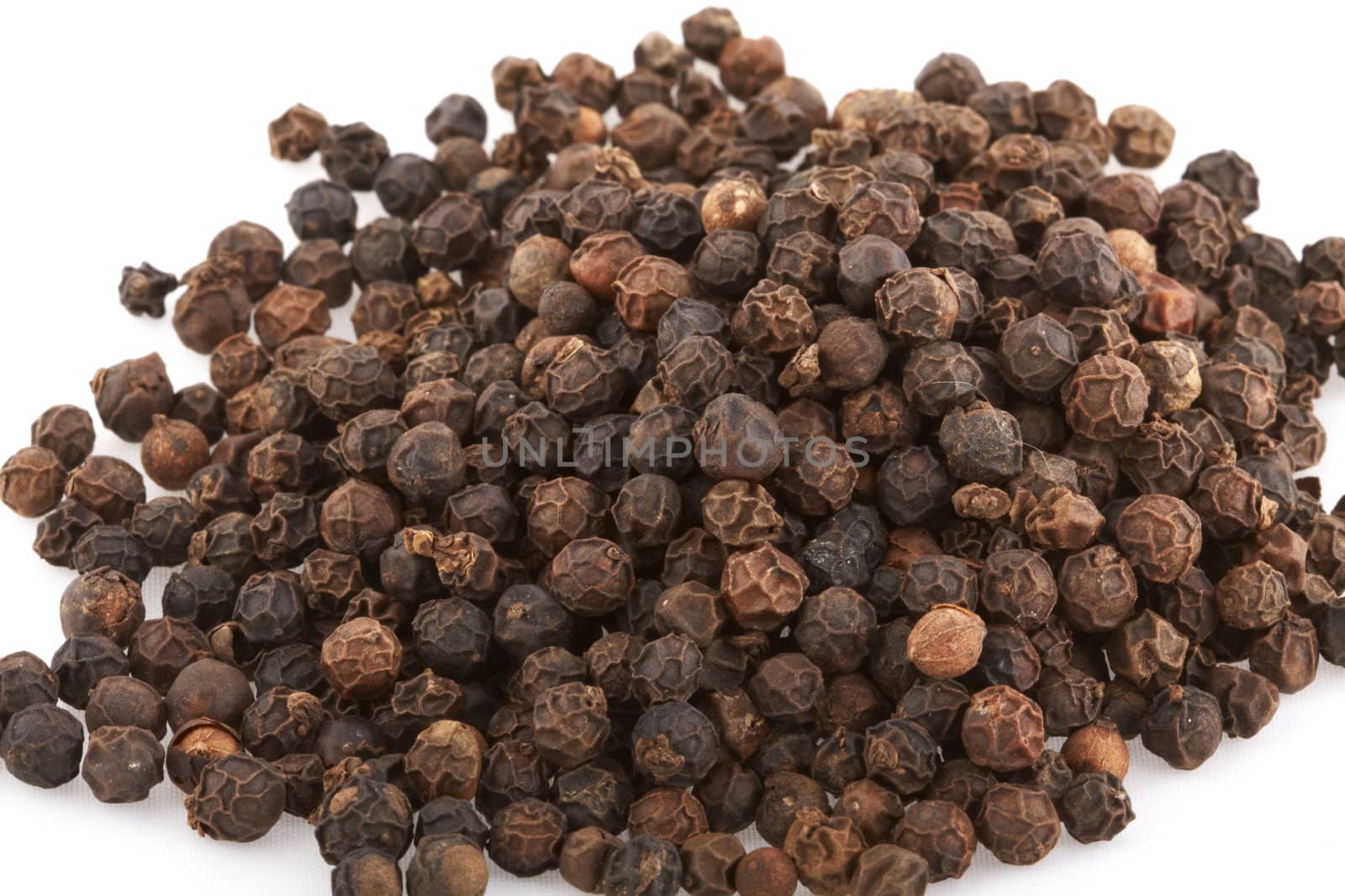 Black Peppercorn seeds on white