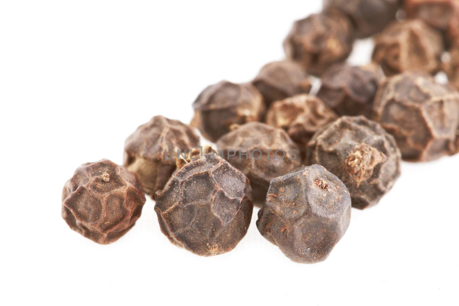 Black Peppercorn seeds on white