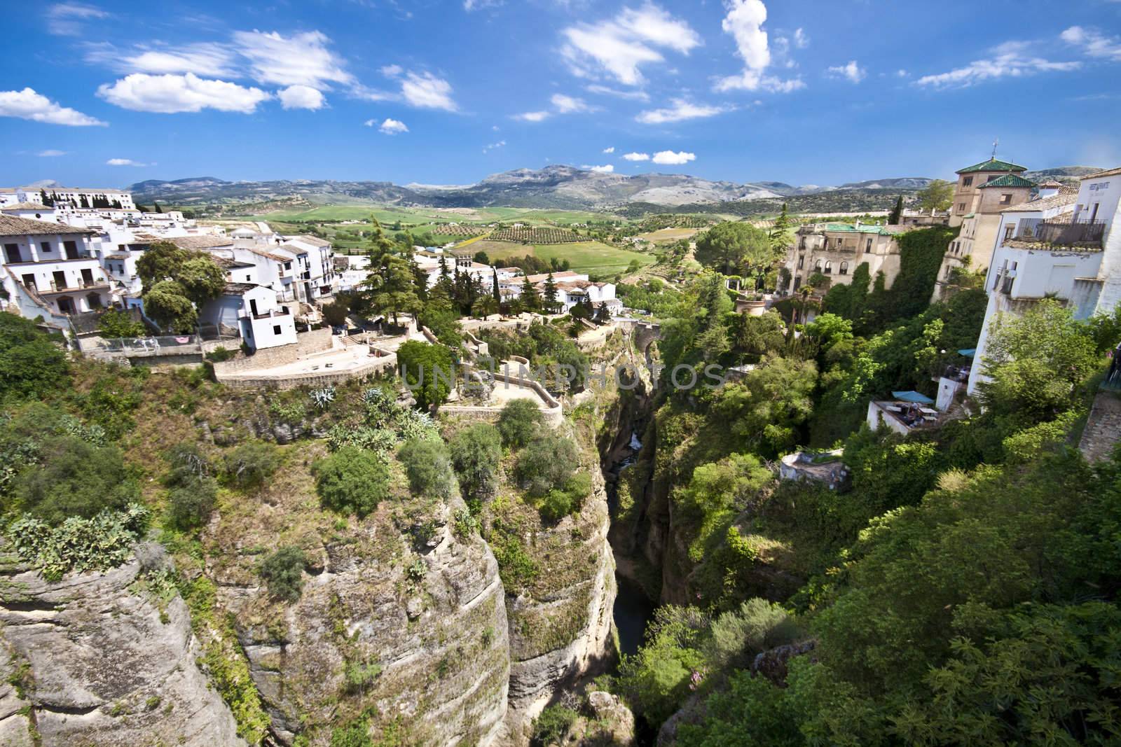 Panoramic view from a new bridge in Ronda, one of the famous white villages in Andalusia, Spain