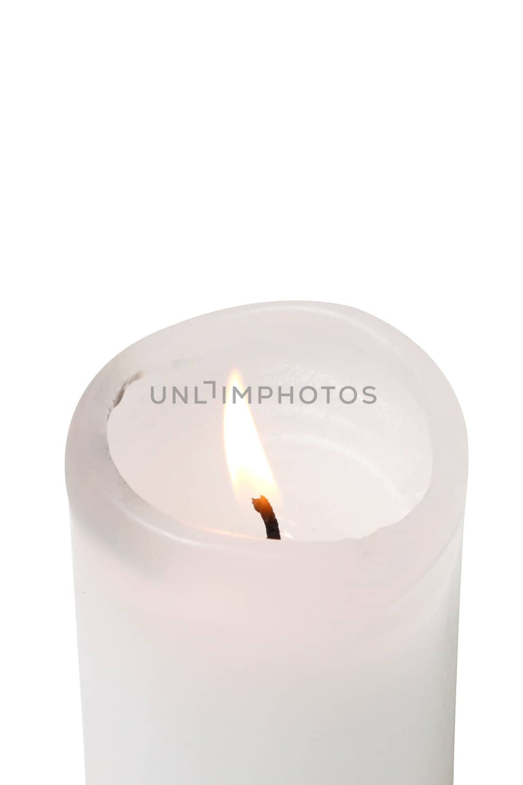 A burning candle isolated on white