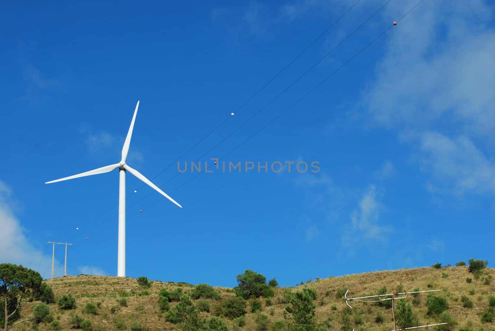 Wind turbine on the top of a mountain by luissantos84