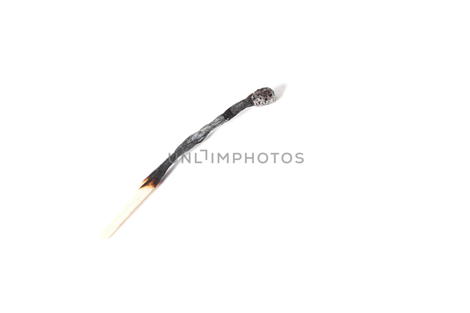 A burned match isolated on white