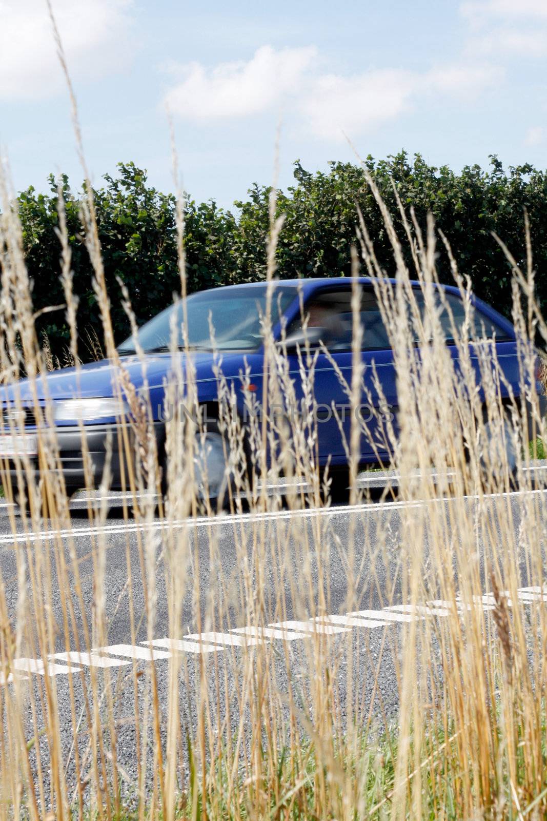 A car driving fast on a road