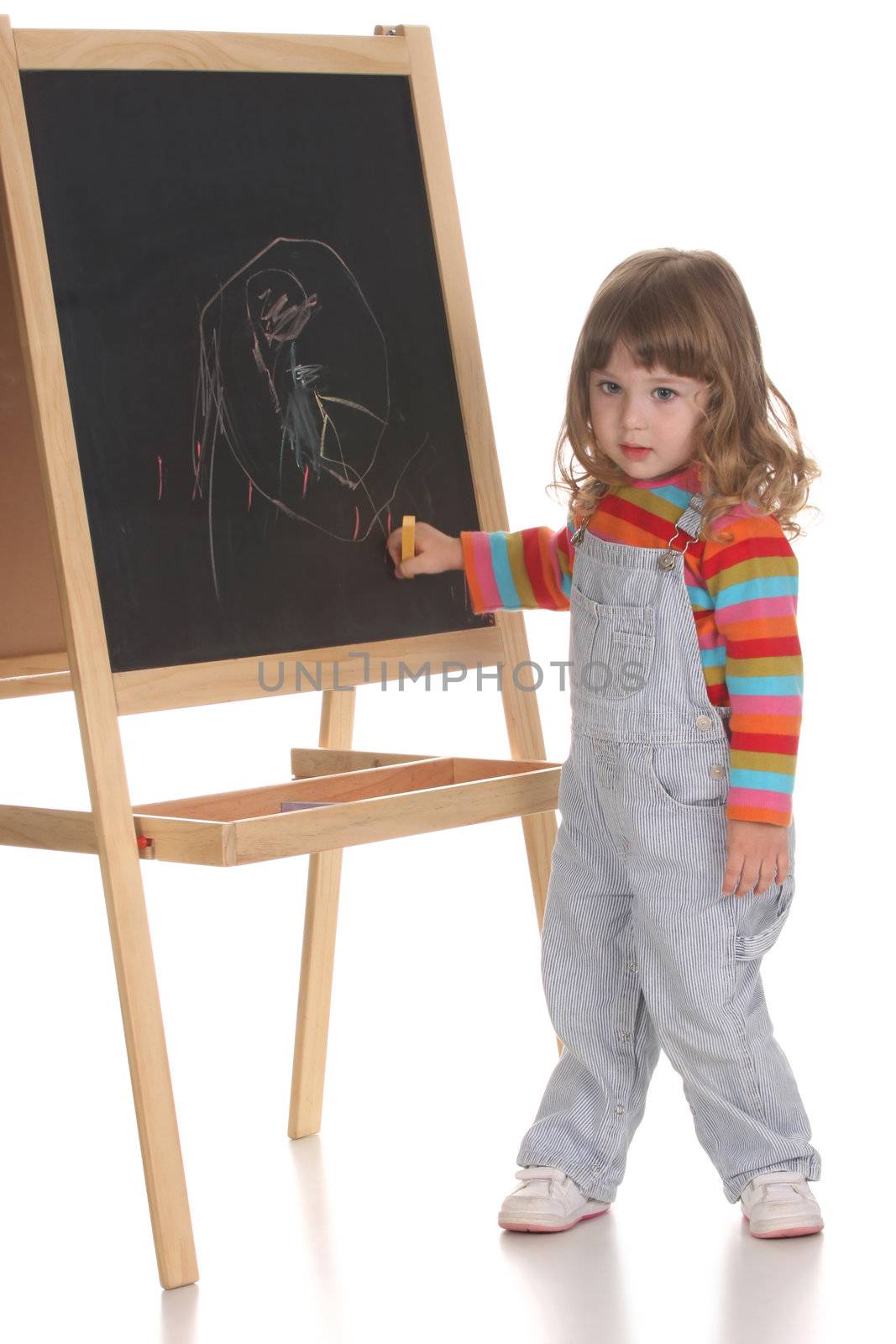 beauty a little girl writing on a blackboard