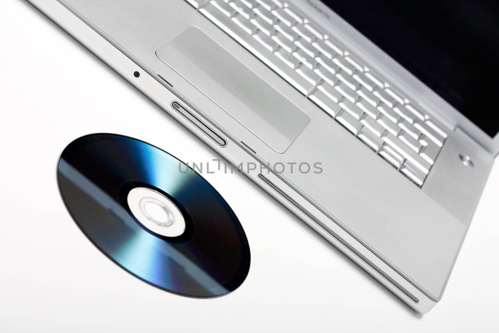 Laptop and CD isolated on white