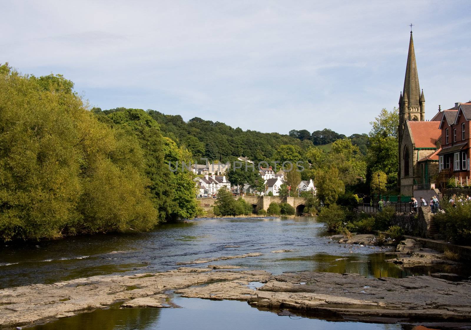 Wide view of the river flowing through the center of Llangollen in Wales