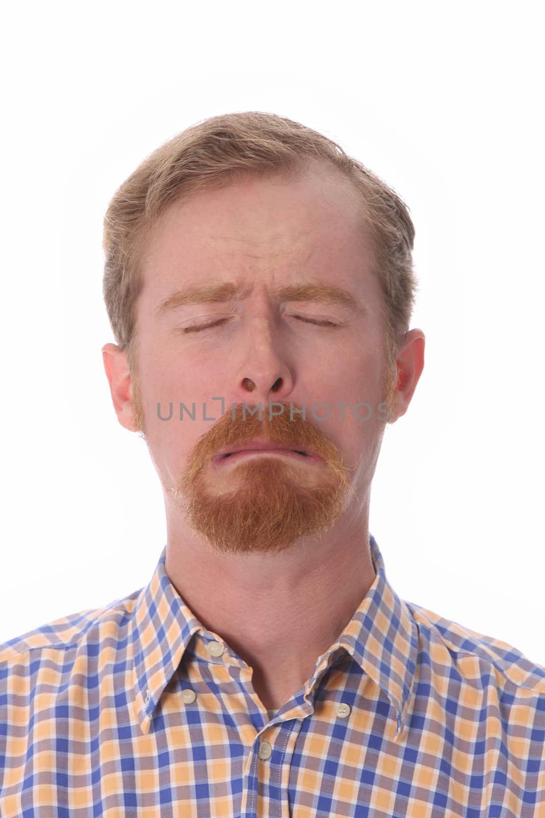 Portrait of man crying, on white background 