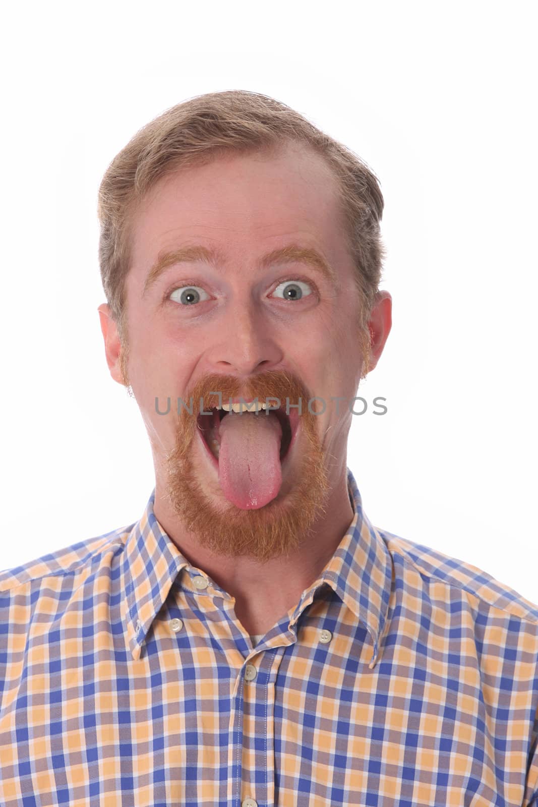 Portrait of man showing his tongue