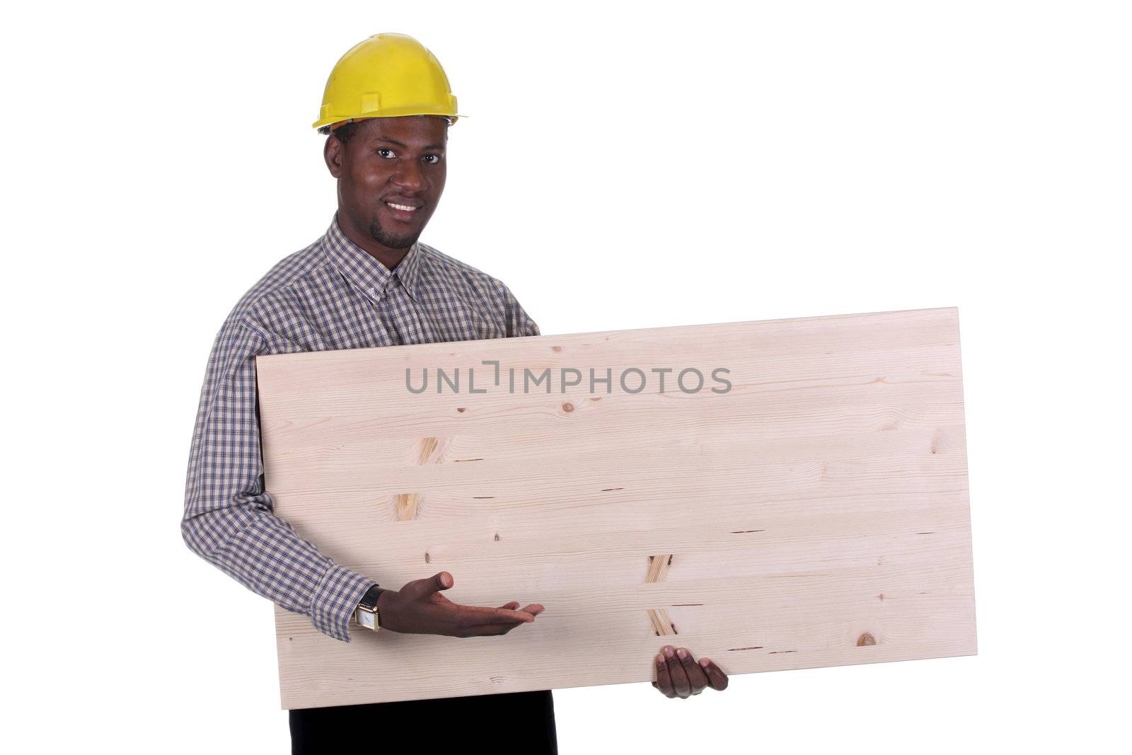 Young african american carpenter holding wooden plank on white background 