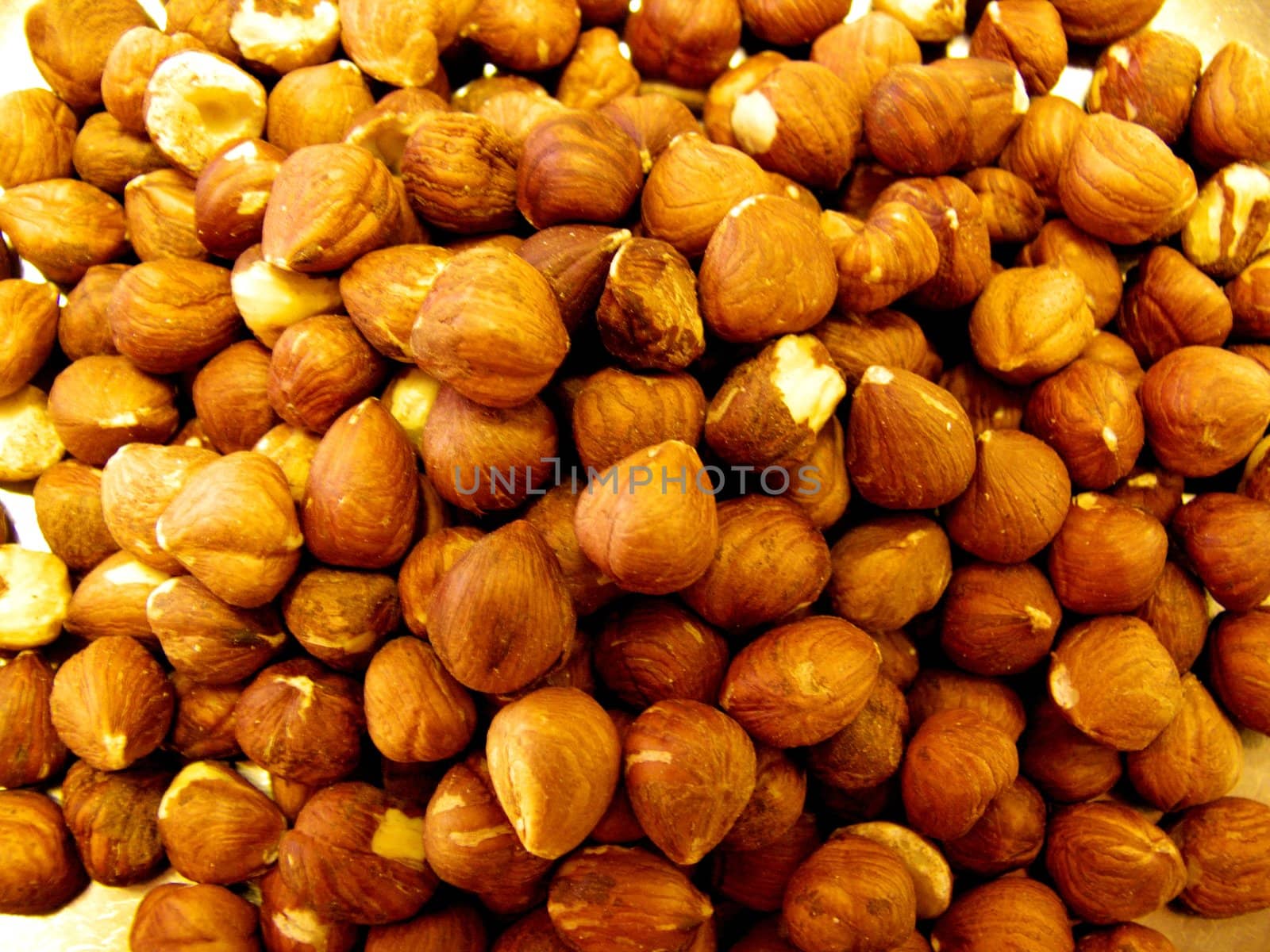 portrait of pile of peeled hazelnuts