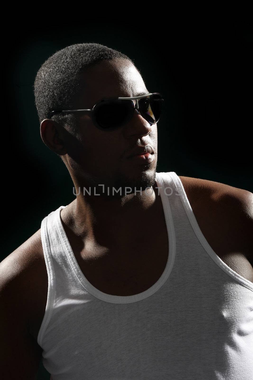 Young african american male on black background