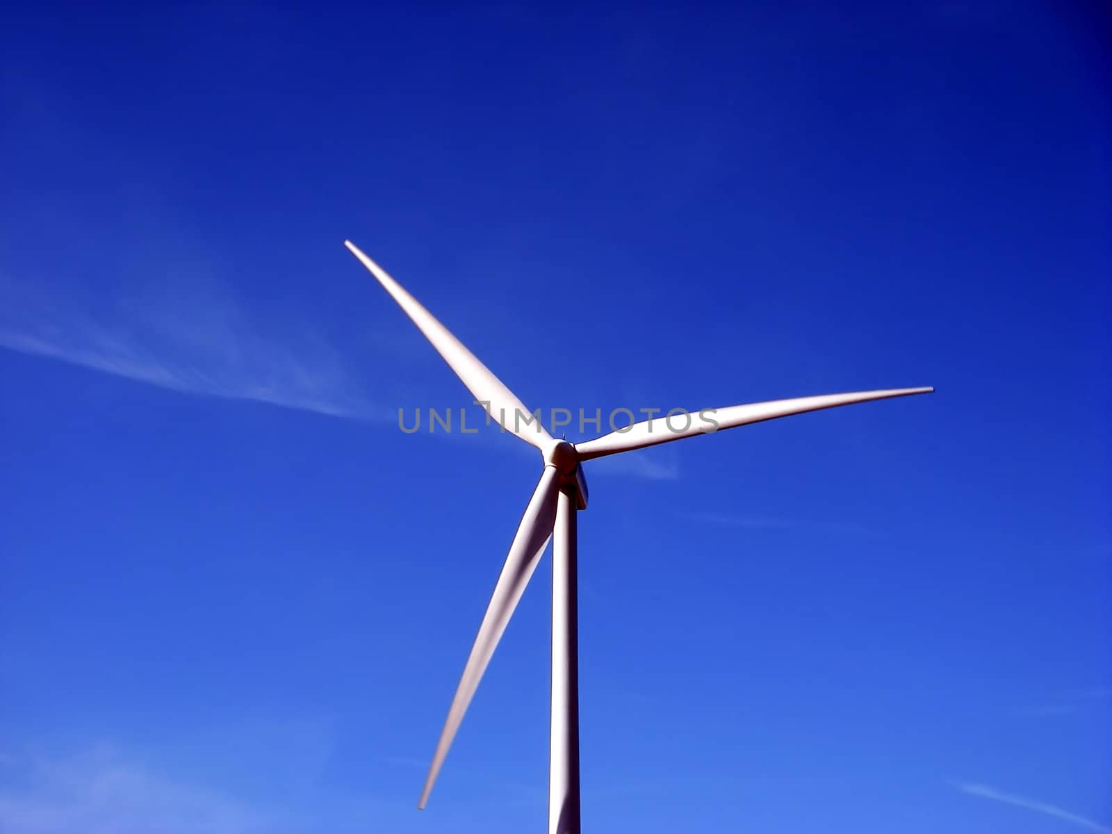 close-up portrait of wind turbine in blue sky