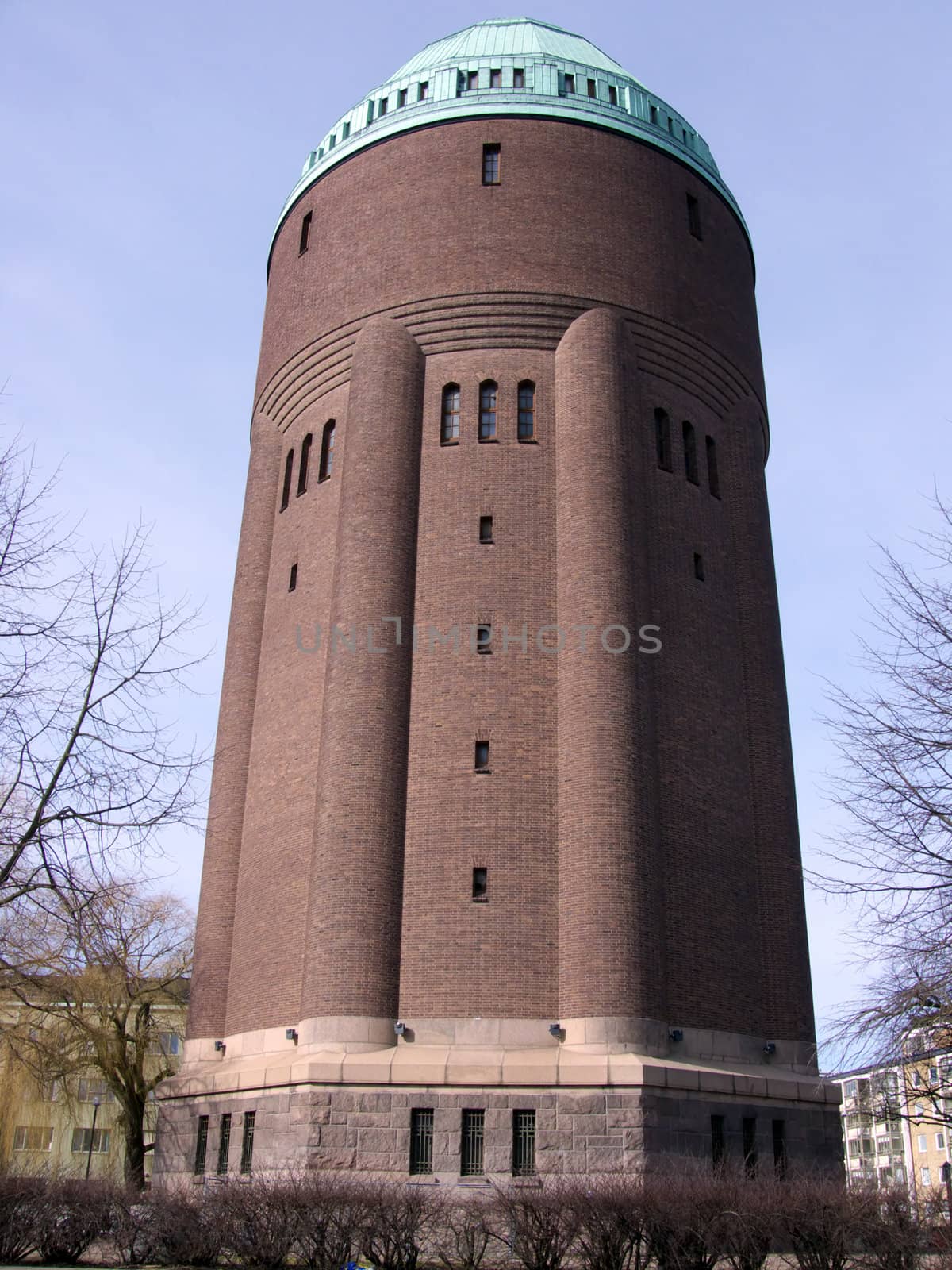 portrait of huge water tower in blue sky