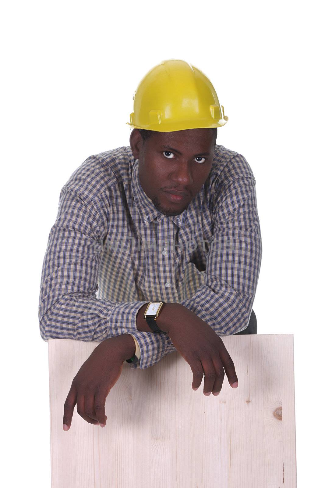 Young african american carpenter holding wooden plank on white background 