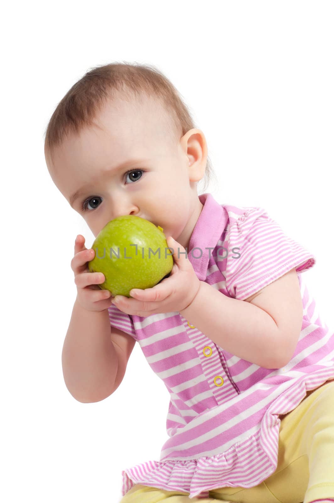 Baby girl in pink eating apple by anytka