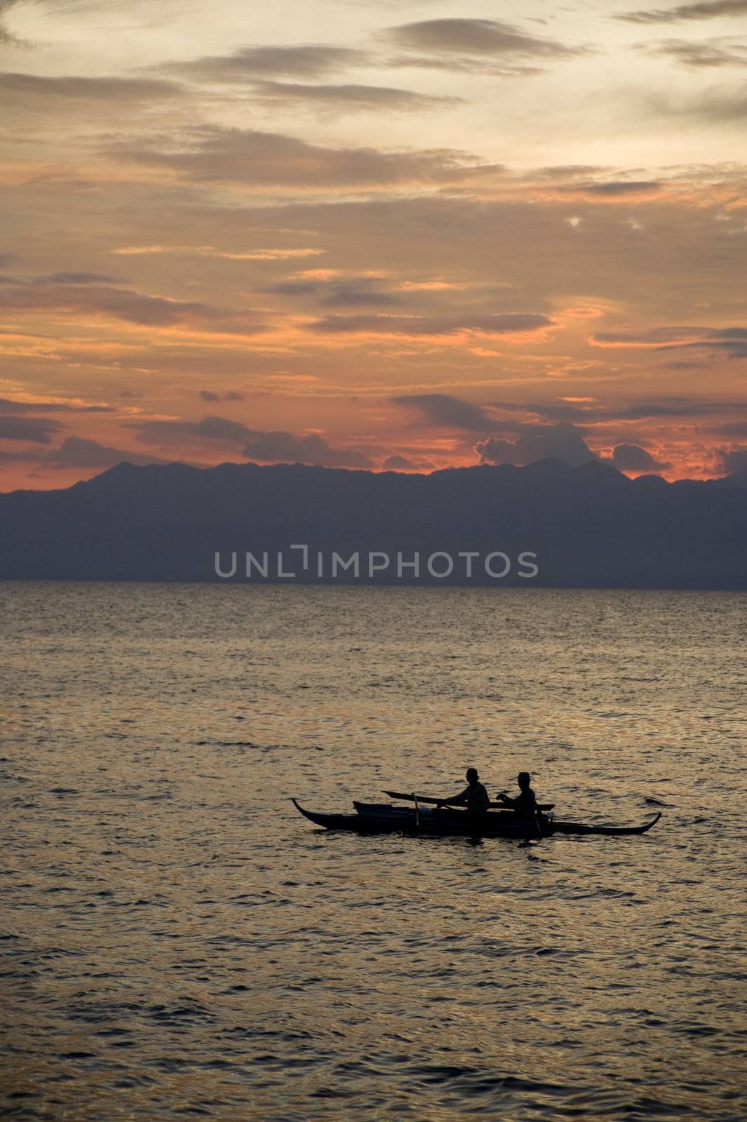 Local Philipino fisherman return to port after a long day.