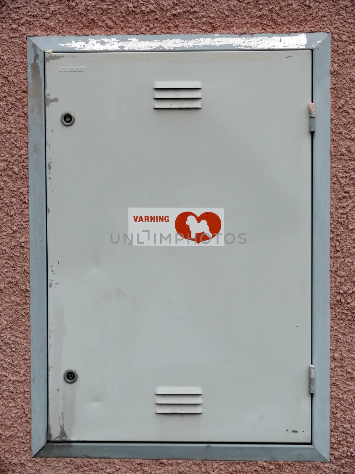 portrait of locker with a dog sign