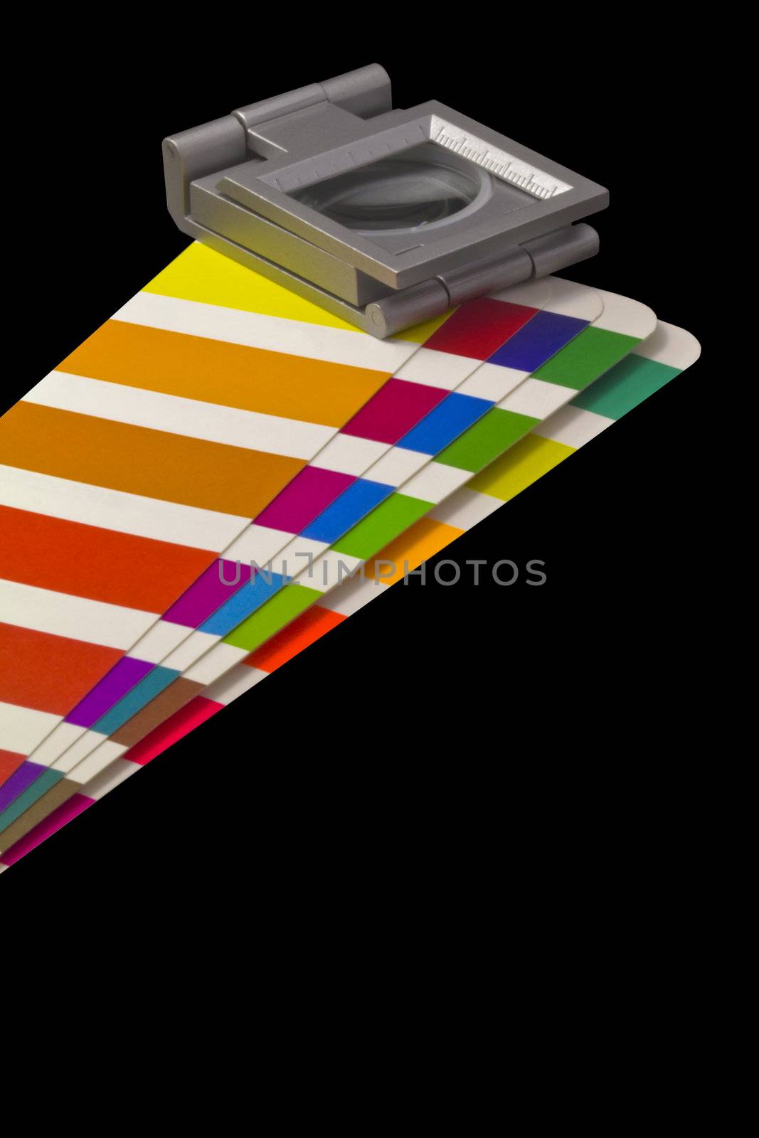 Color guide for offset print with a magnifier lens over the table