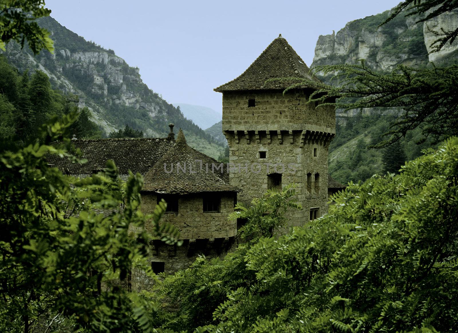 Sone turrets on castle in rocky gorge in Europe