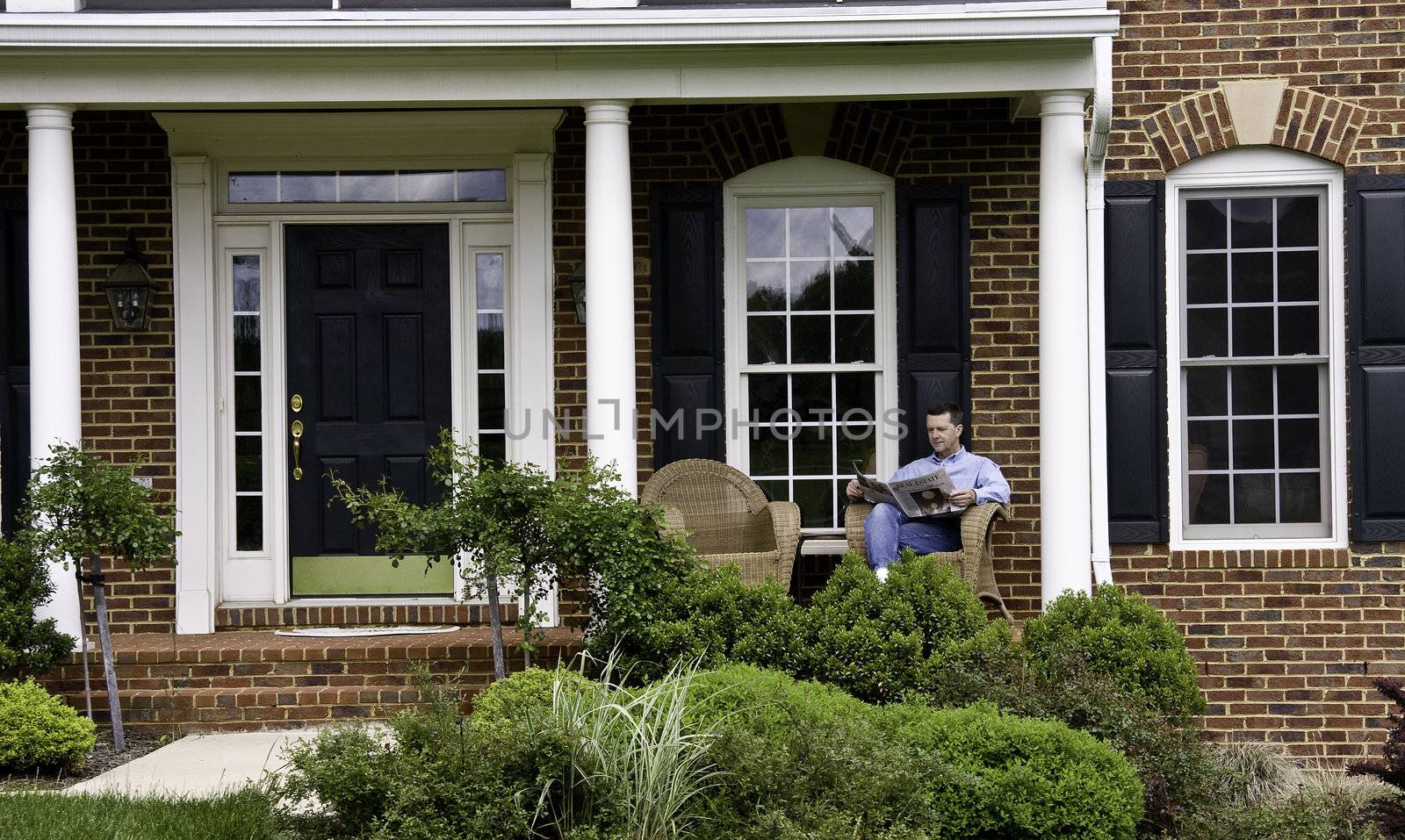 Man relaxed on porch by steheap