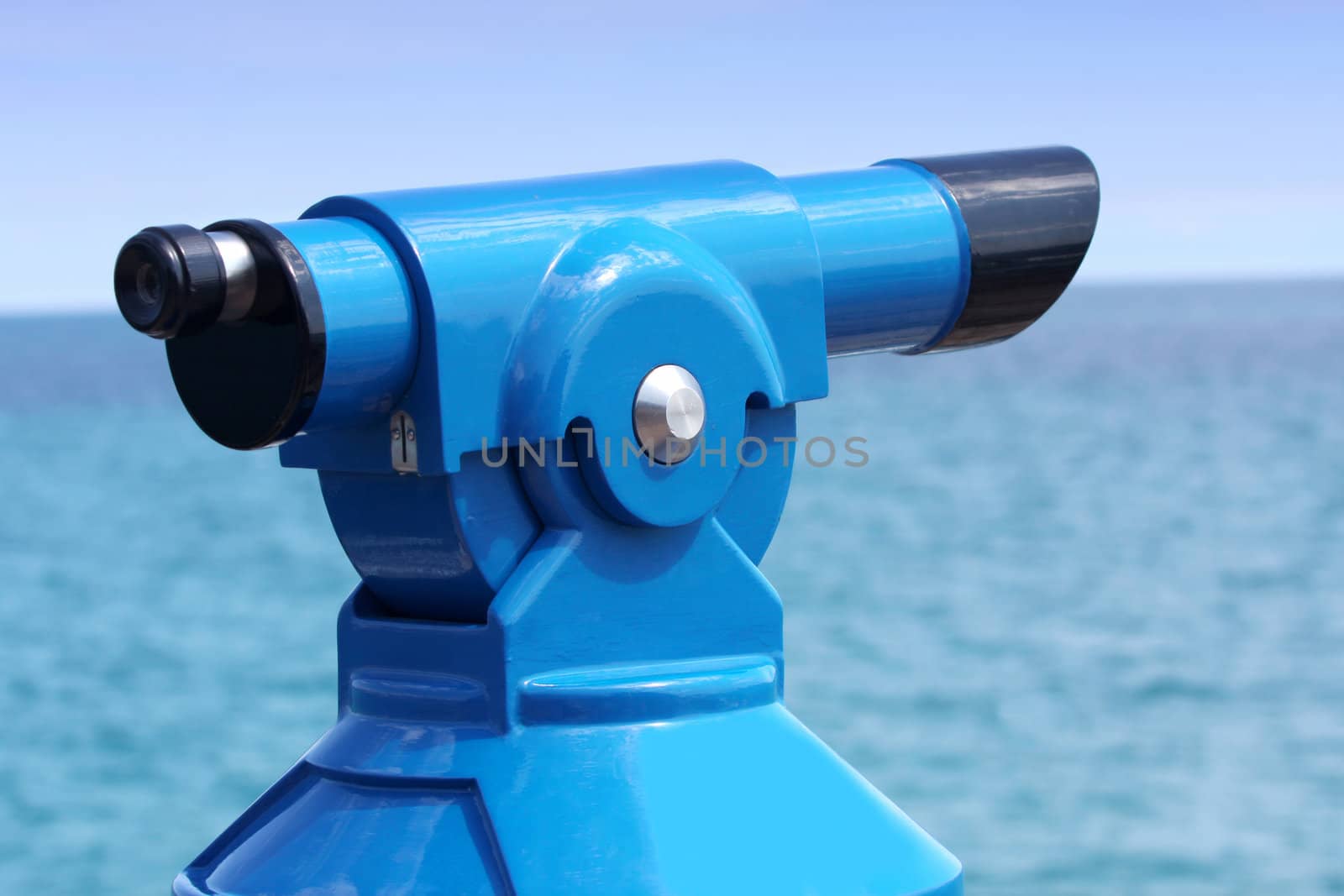 Coin operated binoculars on the pier in Costa Brava, Spain