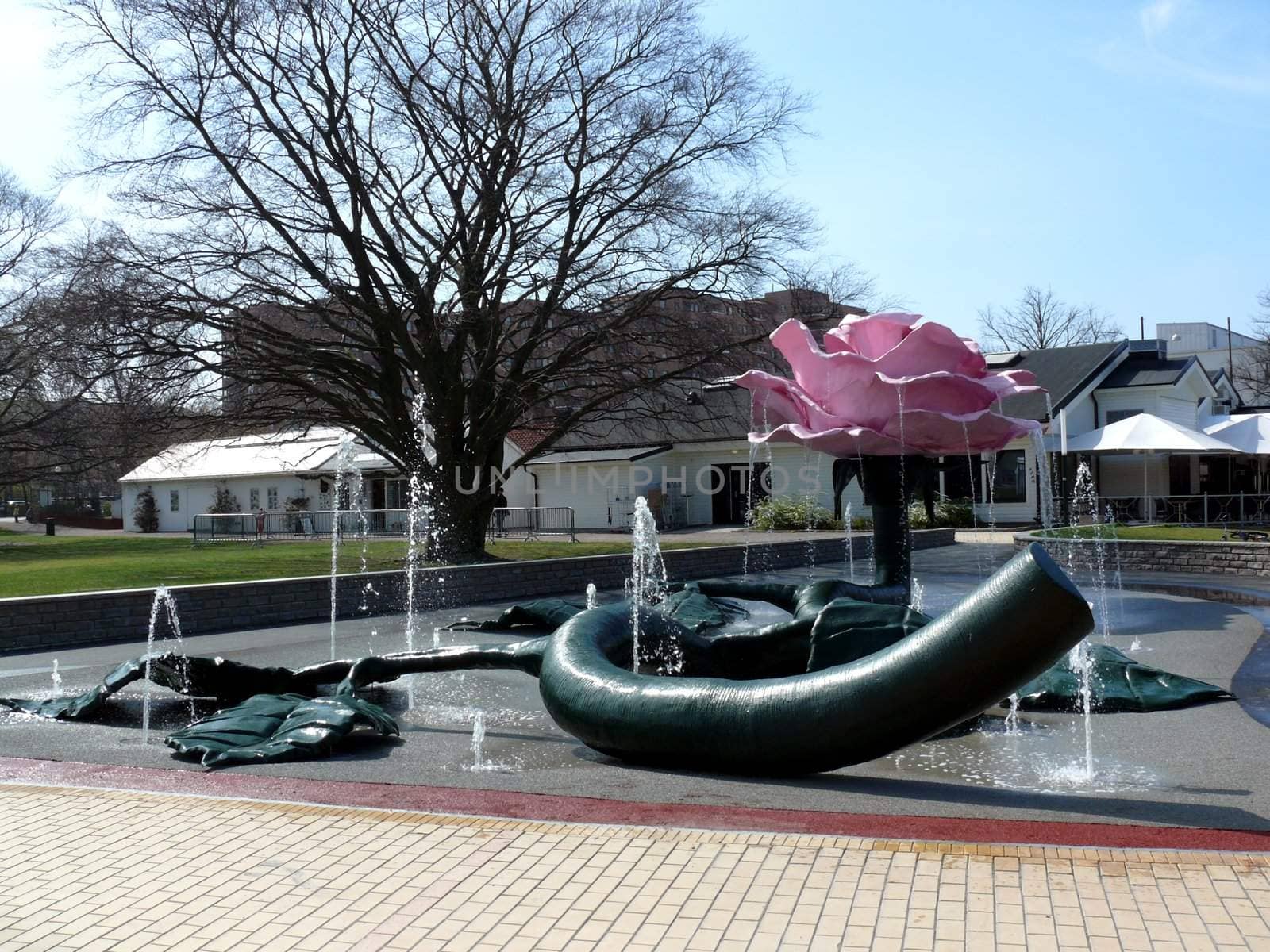 portrait of pink giant rose sculpture in park