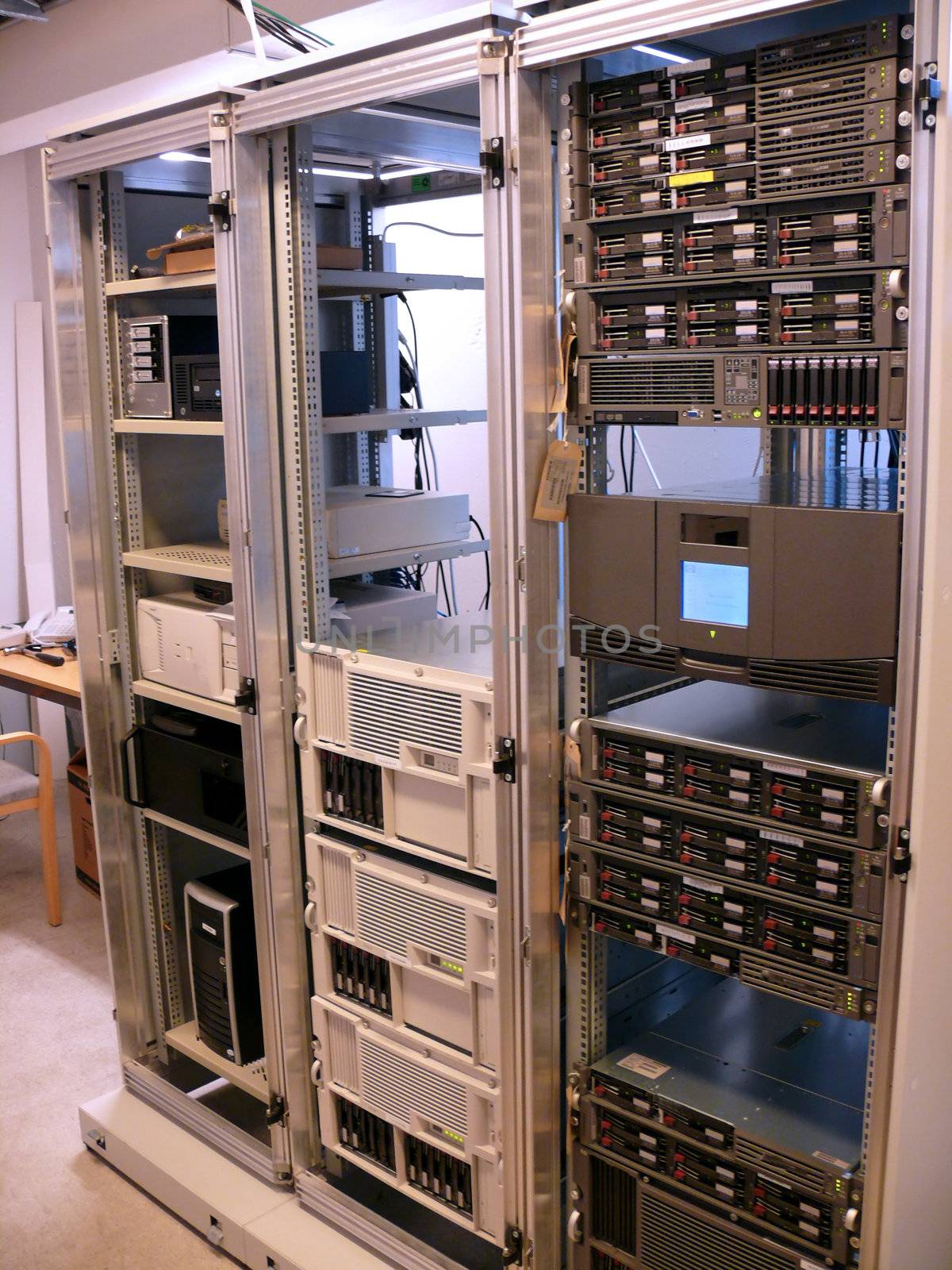 portrait of data central room with server racks
