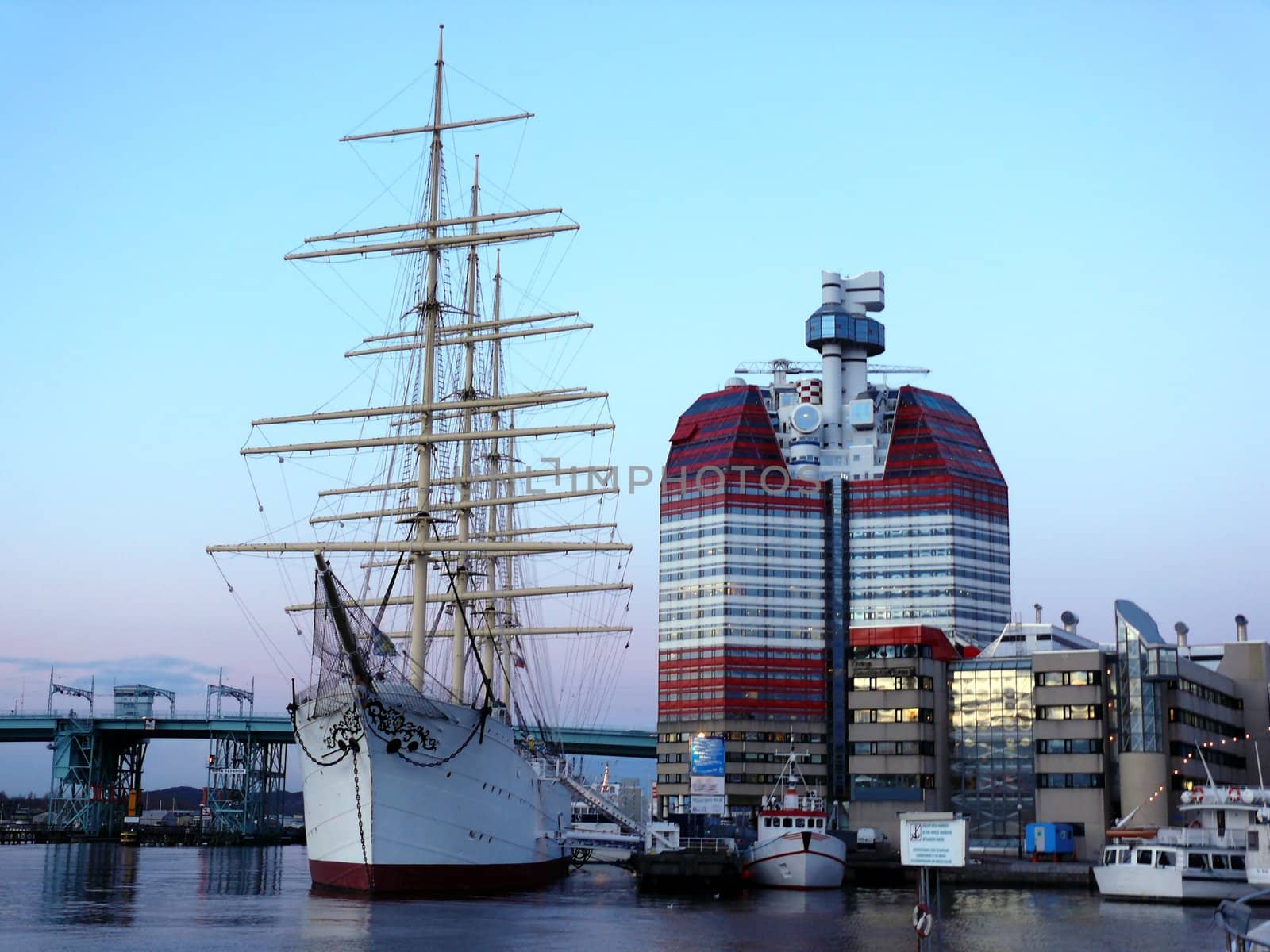 portrait of sail ship in the harbour in beautiful sunset