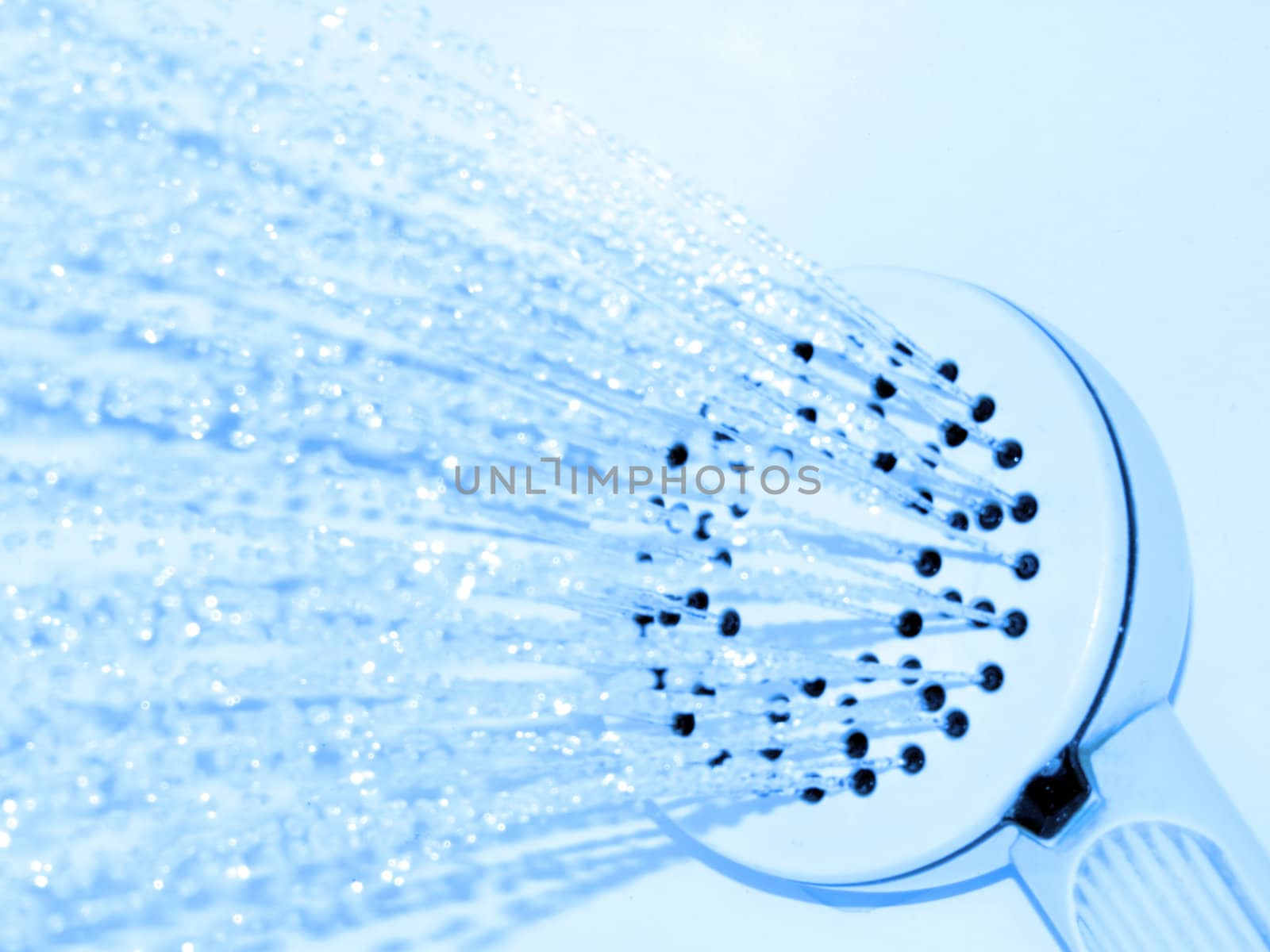 portrait of shower handle and water bluefilter