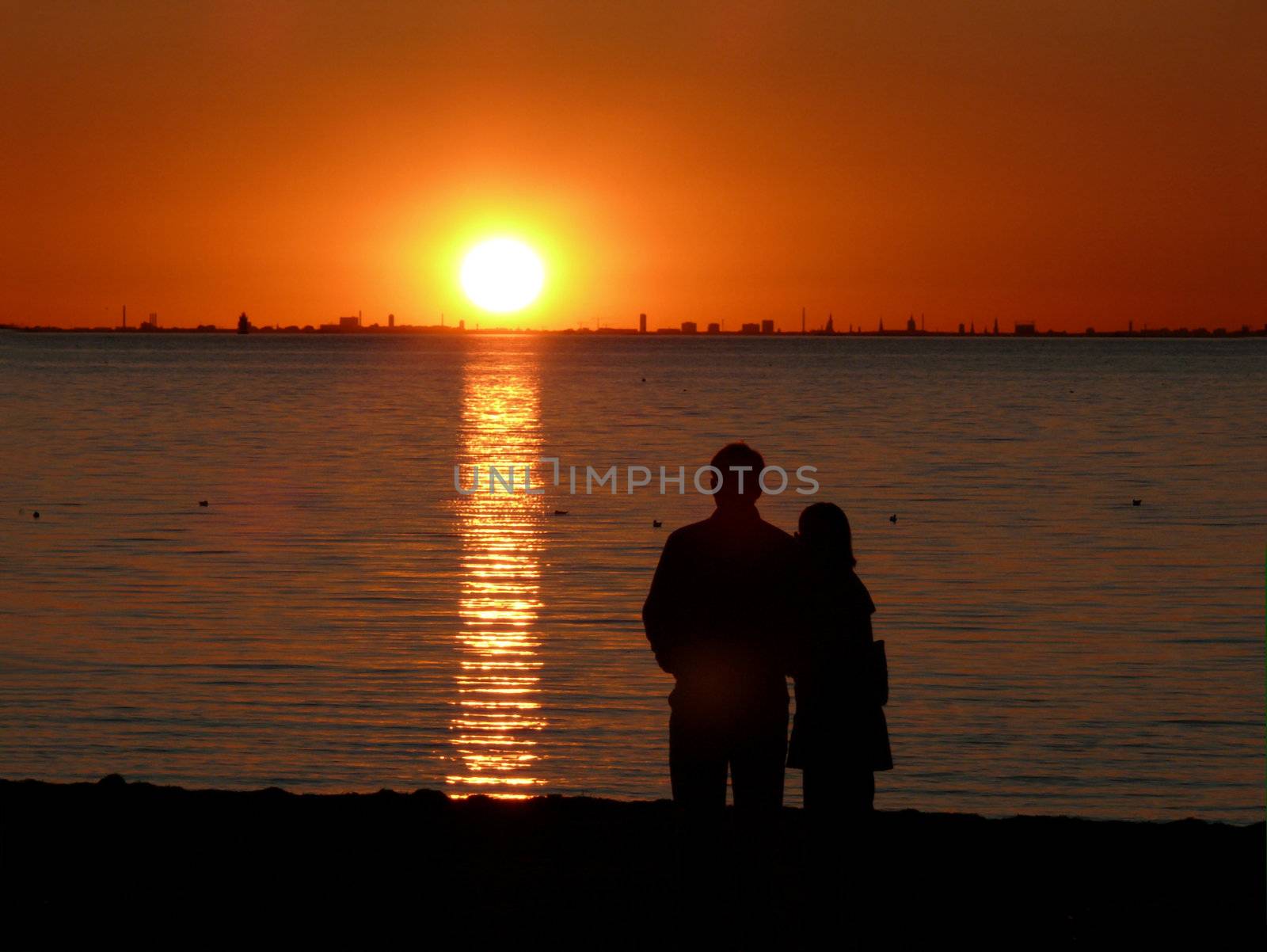 portrait of midnight sun and couple enjoy the landscape