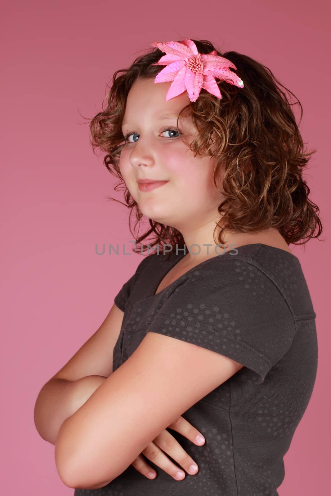 cute caucasian preteen girl, pink background