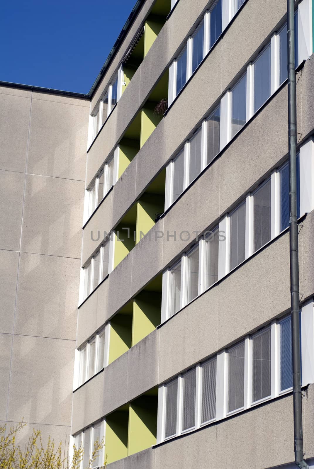 portrait of building with reflection and sun shade