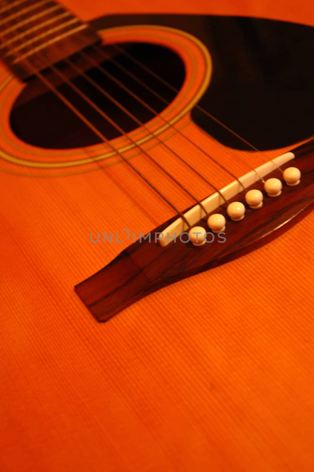 A detail of a wooden spanish guitar