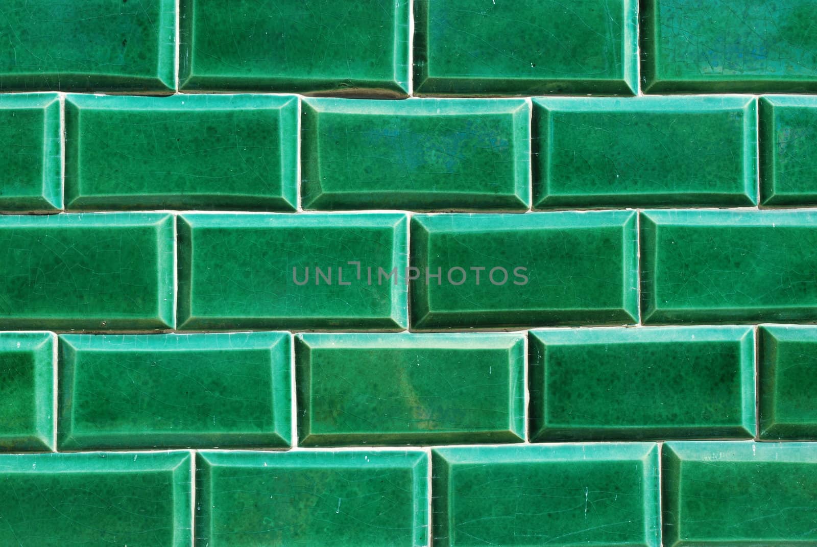 building wall made of green mosaics 